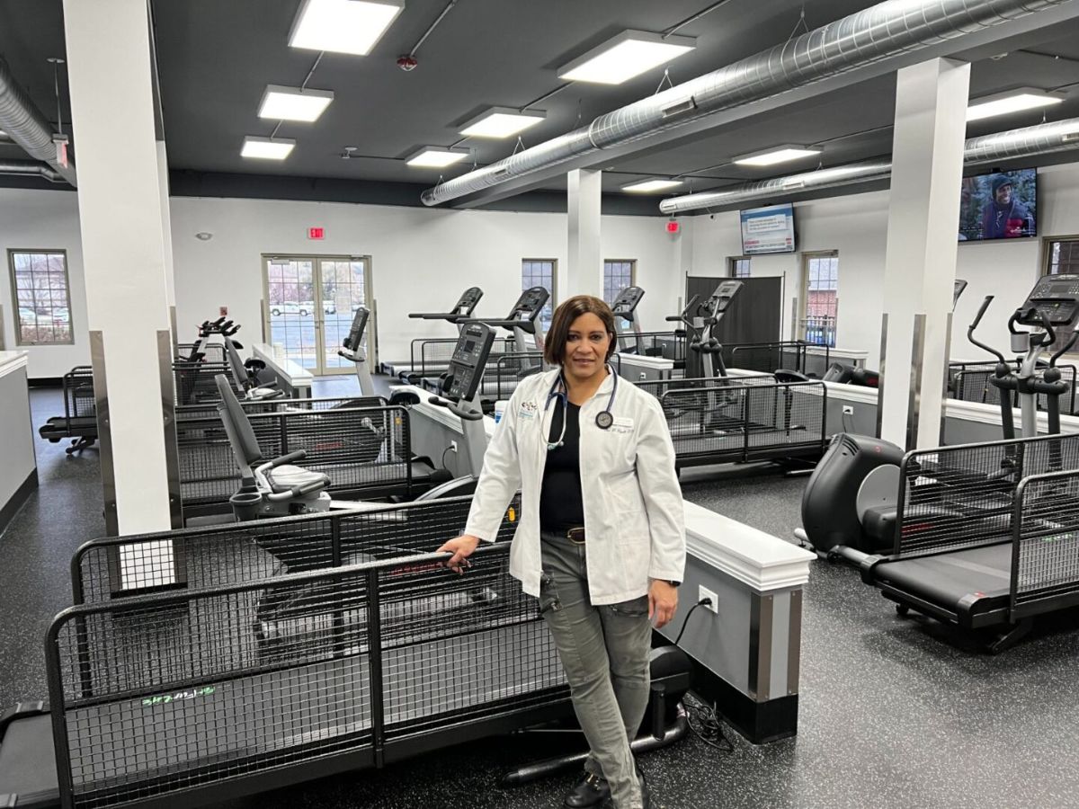 Person in gym with exercise equipment.