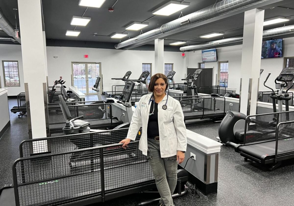 Person in gym with exercise equipment.